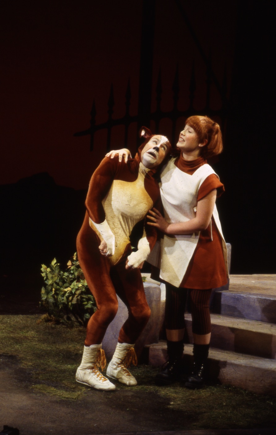 Suzy embracing Neville, production photo, Mr. A's Amazing Maze Play
