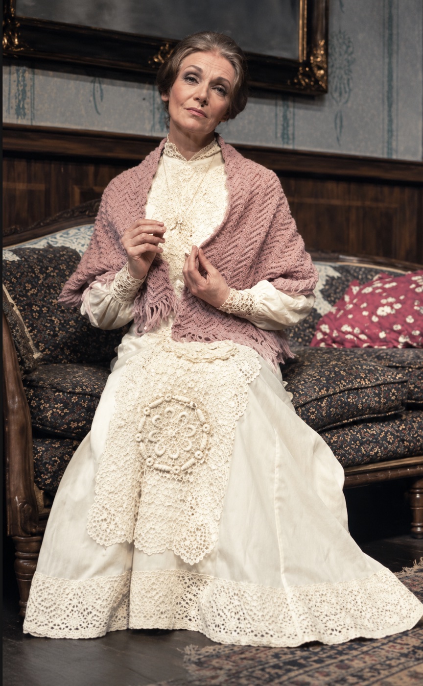Lily, seated in a knit shawl, costume design, Ah, Wilderness!, by Laura Crow