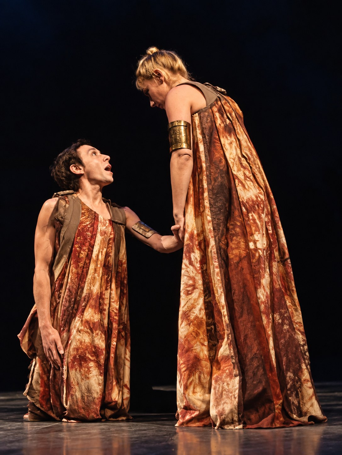 Antigone and Ismene in gold draped costumes, Antigone, Greenwich Theatre, London, costumes by Laura Crow
