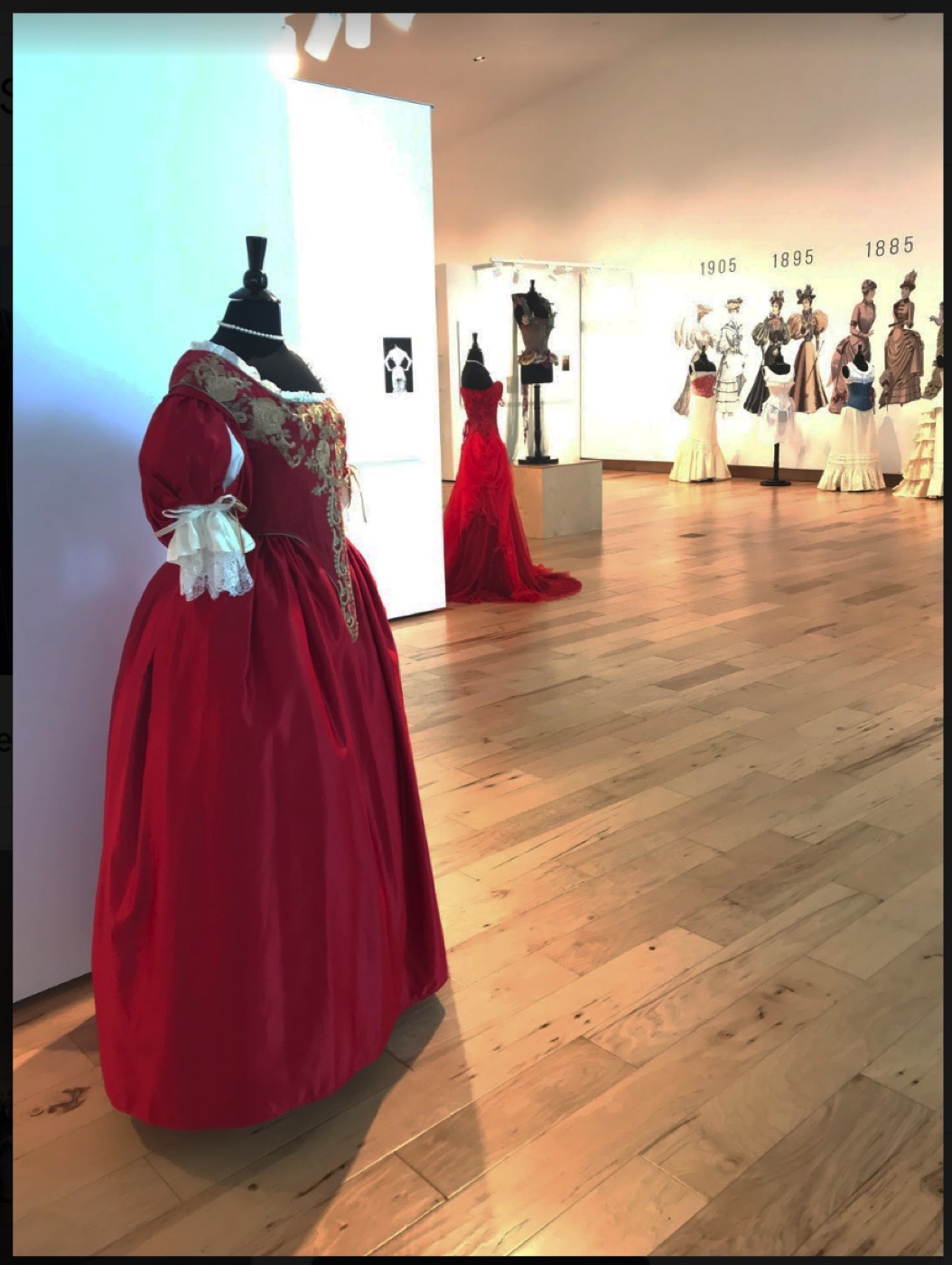 Gallery overview with the exhibition entrance and 1795 to 1820 silhouette wall, The Corset as Art, SUMA