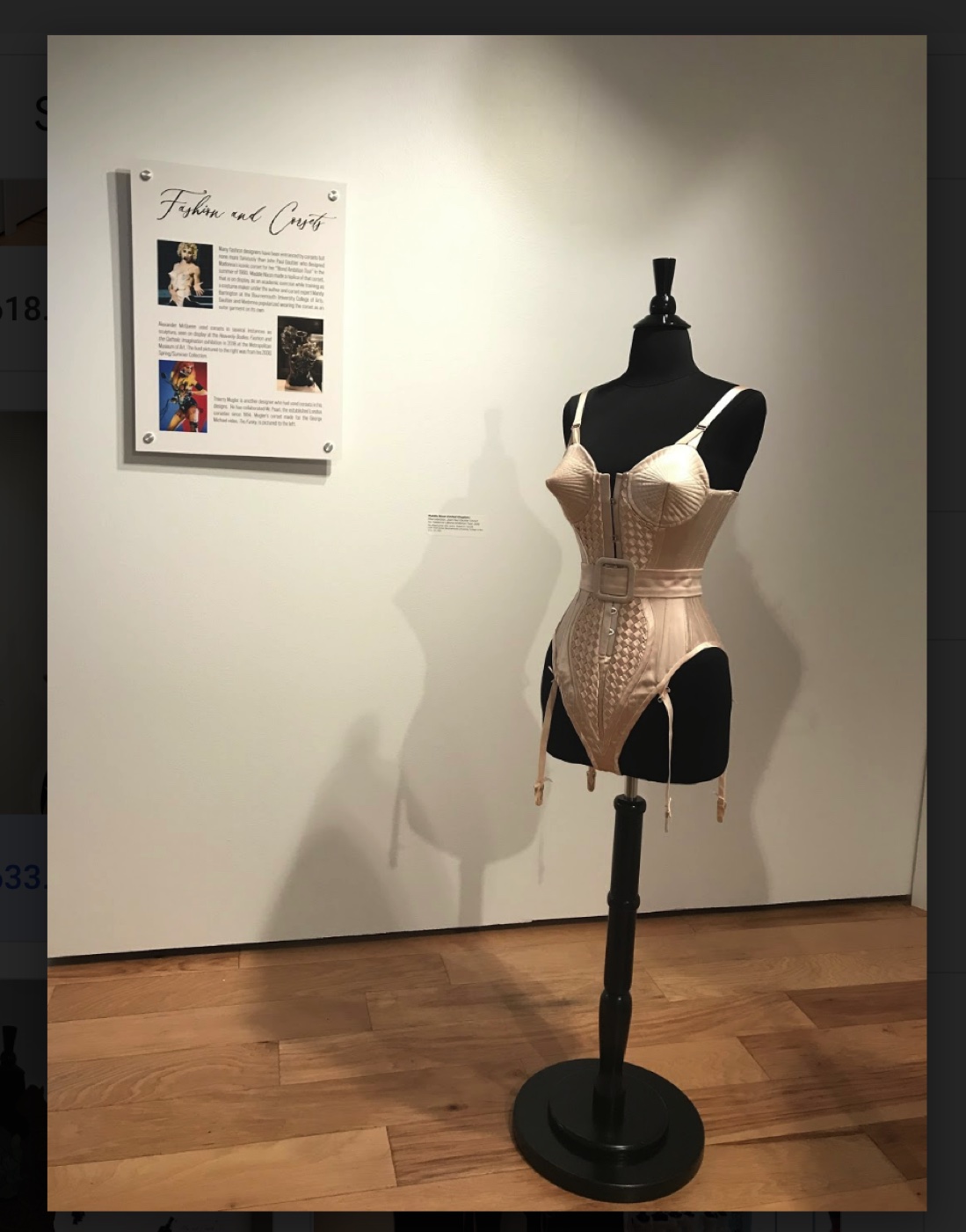 Cream corset with Fashion and Corsets text panel referencing Madonna and Jean Paul Gaultier, The Corset as Art, SUMA