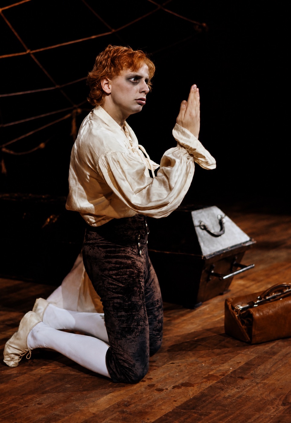 Jonathan Harker kneeling by the coffin, rehearsal photograph, Dracula