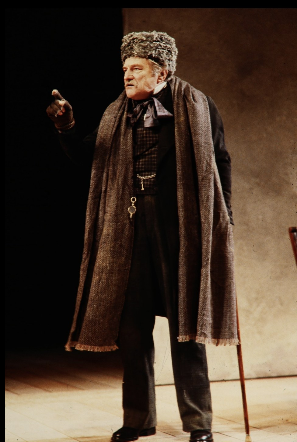 Man wearing a dark cape and fur hat, An Enemy of the People, Seattle Repertory Theatre, costumes by Laura Crow