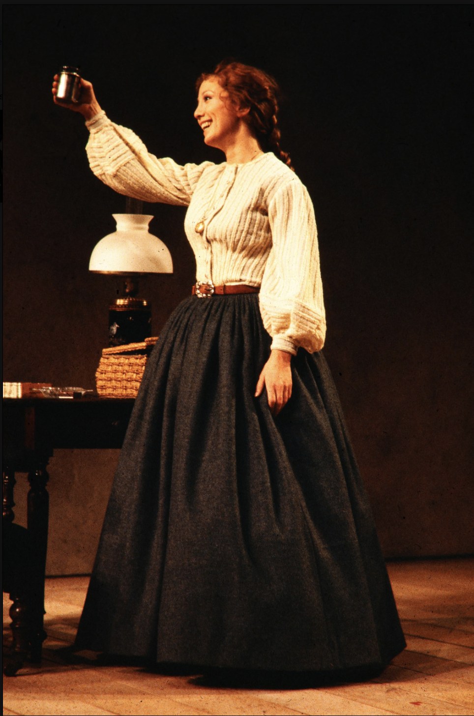 Woman holding a lamp, An Enemy of the People, Seattle Repertory Theatre, costumes by Laura Crow