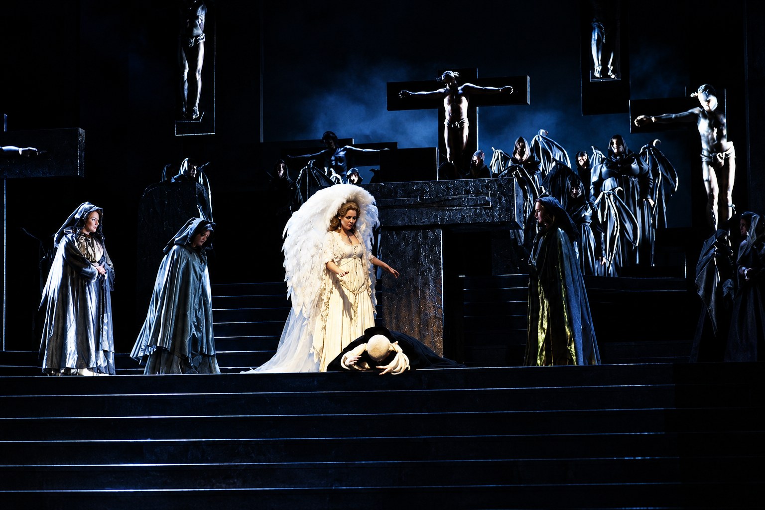 White-winged performer surrounded by cloaked figures, Falstaff, University of Michigan, costumes by Laura Crow