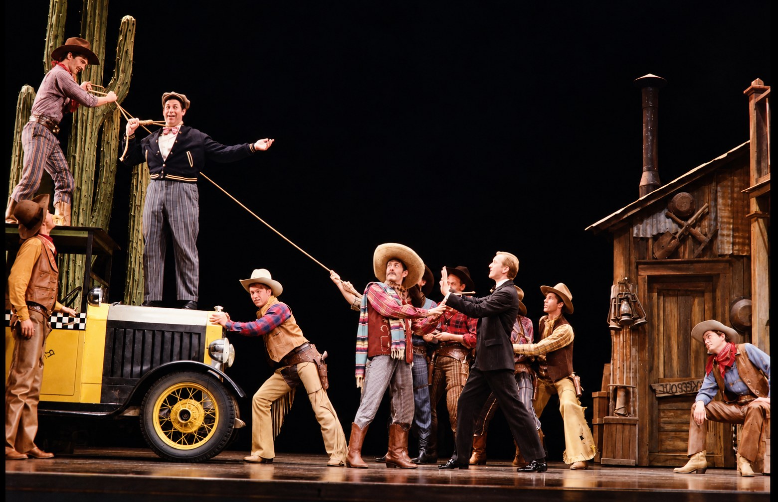 Eugene and the townspeople with the taxi, production photo, Girl Crazy, Seattle Repertory Theatre, costumes by Laura Crow