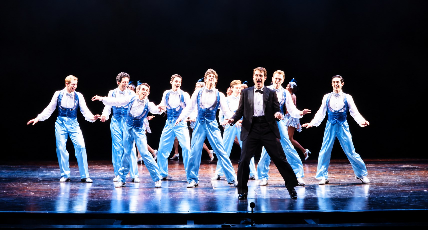 Harry and the male chorus, production photo, Girl Crazy, Seattle Repertory Theatre, costumes by Laura Crow