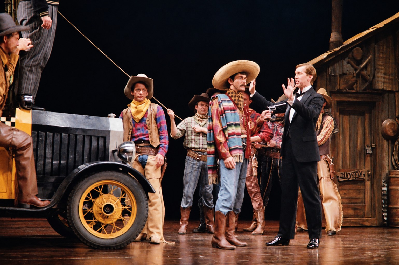 Eugene and the townspeople, close-up, production photo, Girl Crazy, Seattle Repertory Theatre, costumes by Laura Crow