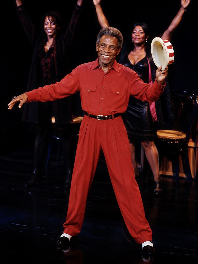 André De Shields in red suit, costume design for Harlem Nocturne