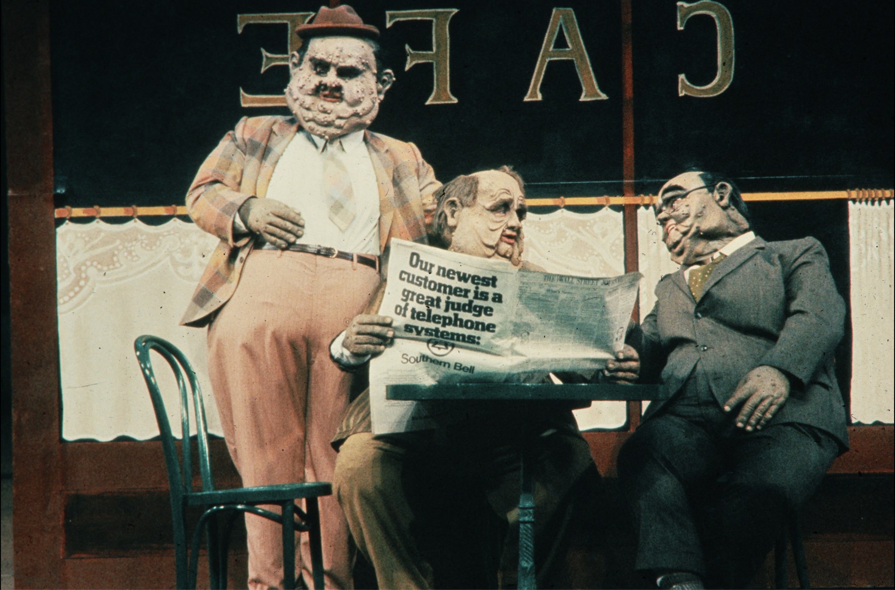 Three costumed performers in a cafe scene, production photo, Orchards, The Acting Company, costumes by Laura Crow