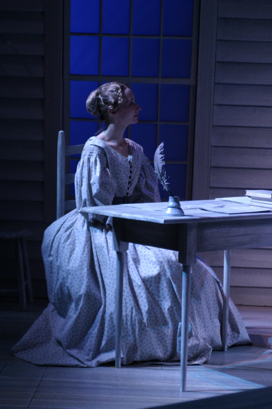 Prudence at her writing desk, production photo, Connecticut Repertory Theatre