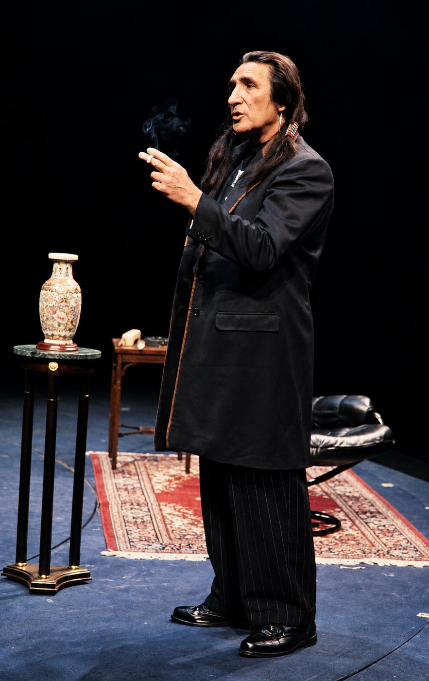Man in a dark suit, production photo, Robbers, Long Wharf Theatre, costumes by Laura Crow