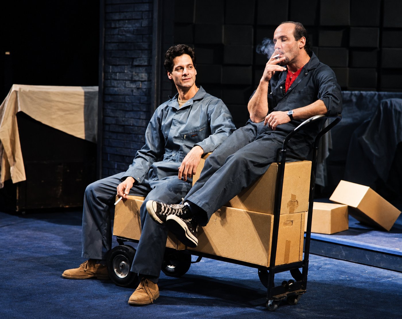 Two men seated, production photo, Robbers, Long Wharf Theatre, costumes by Laura Crow