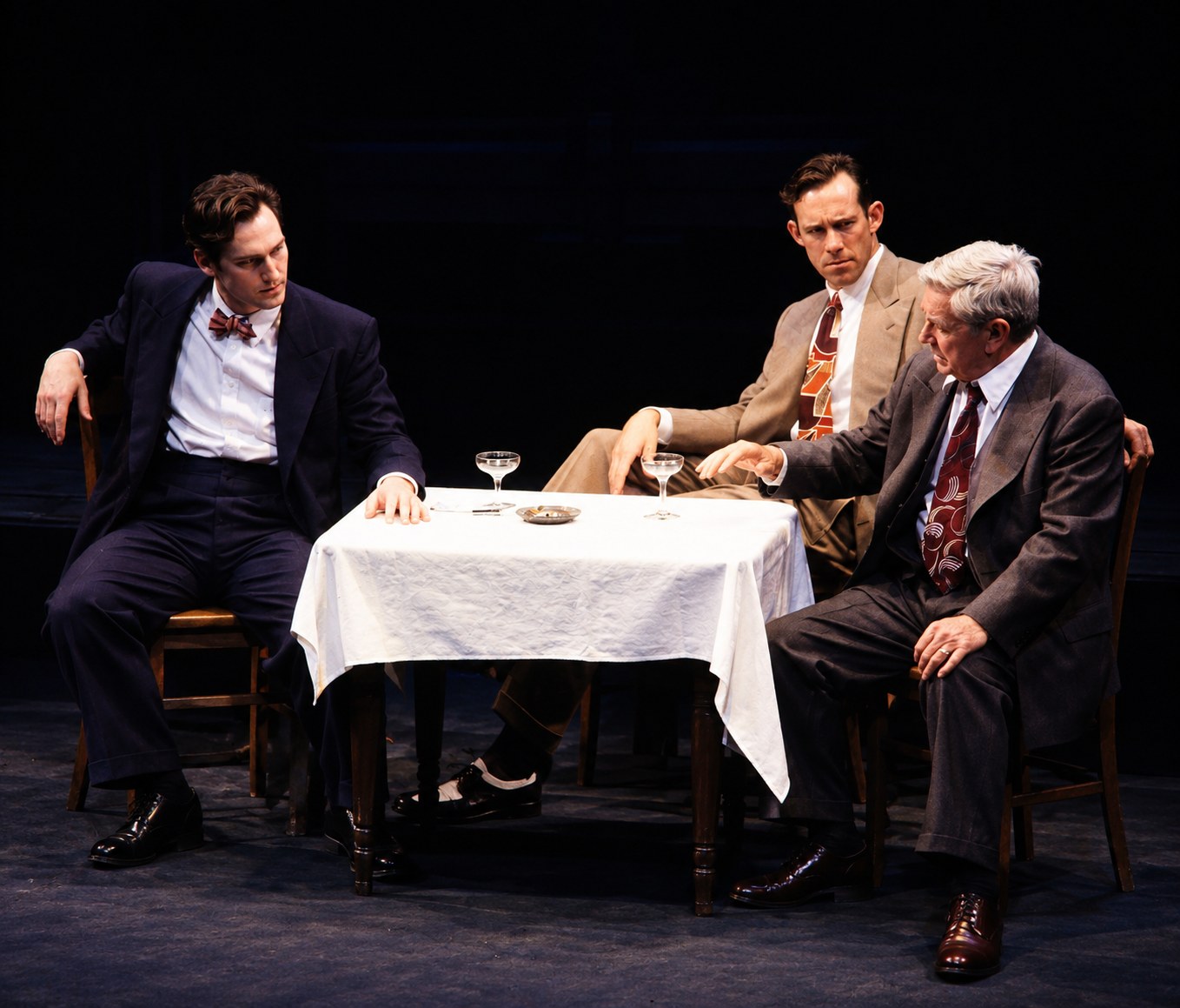 Three men seated around a restaurant table, Death of a Salesman, Alley Theatre, Houston, costumes by Laura Crow