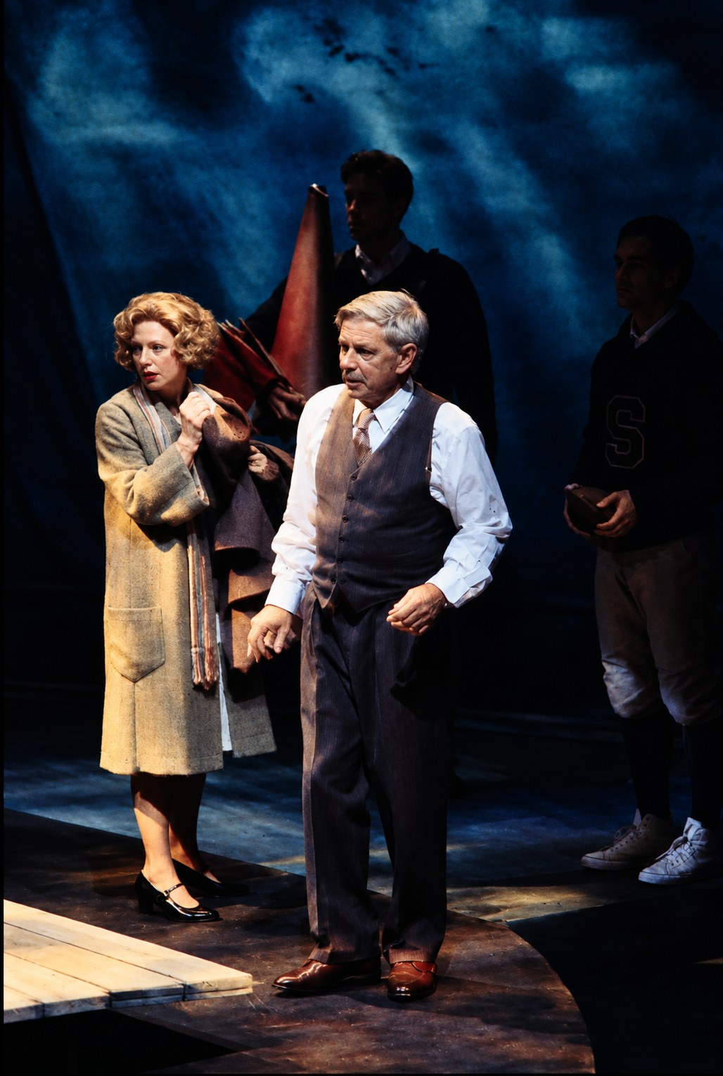 Two men beneath blue stage lighting, Death of a Salesman, Alley Theatre, Houston, costumes by Laura Crow