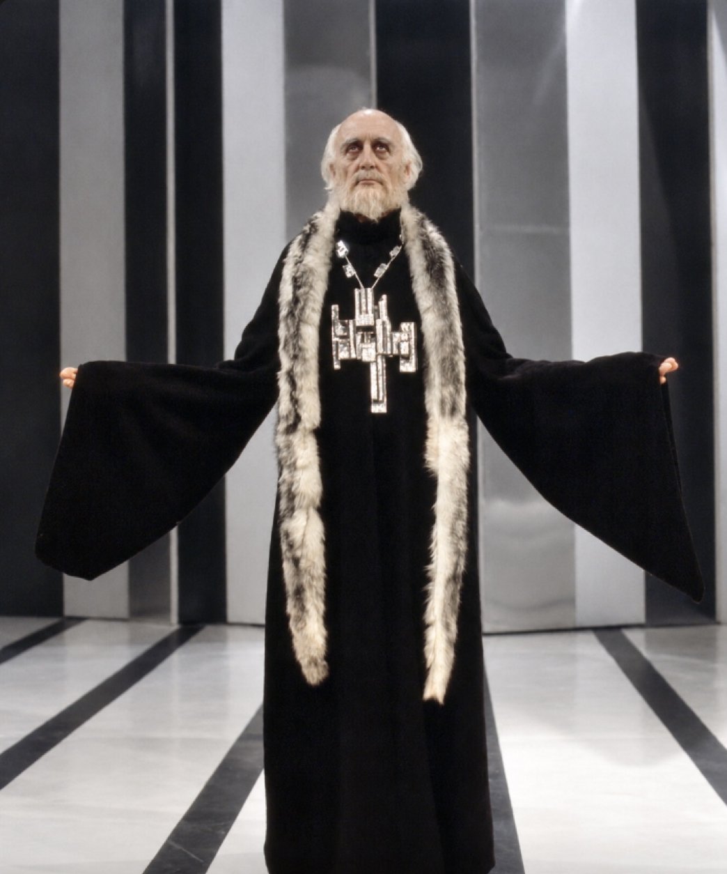 Boris in a black robe with fur stole and jeweled cross, Servants and the Snow, Greenwich Theatre, costumes by Laura Crow