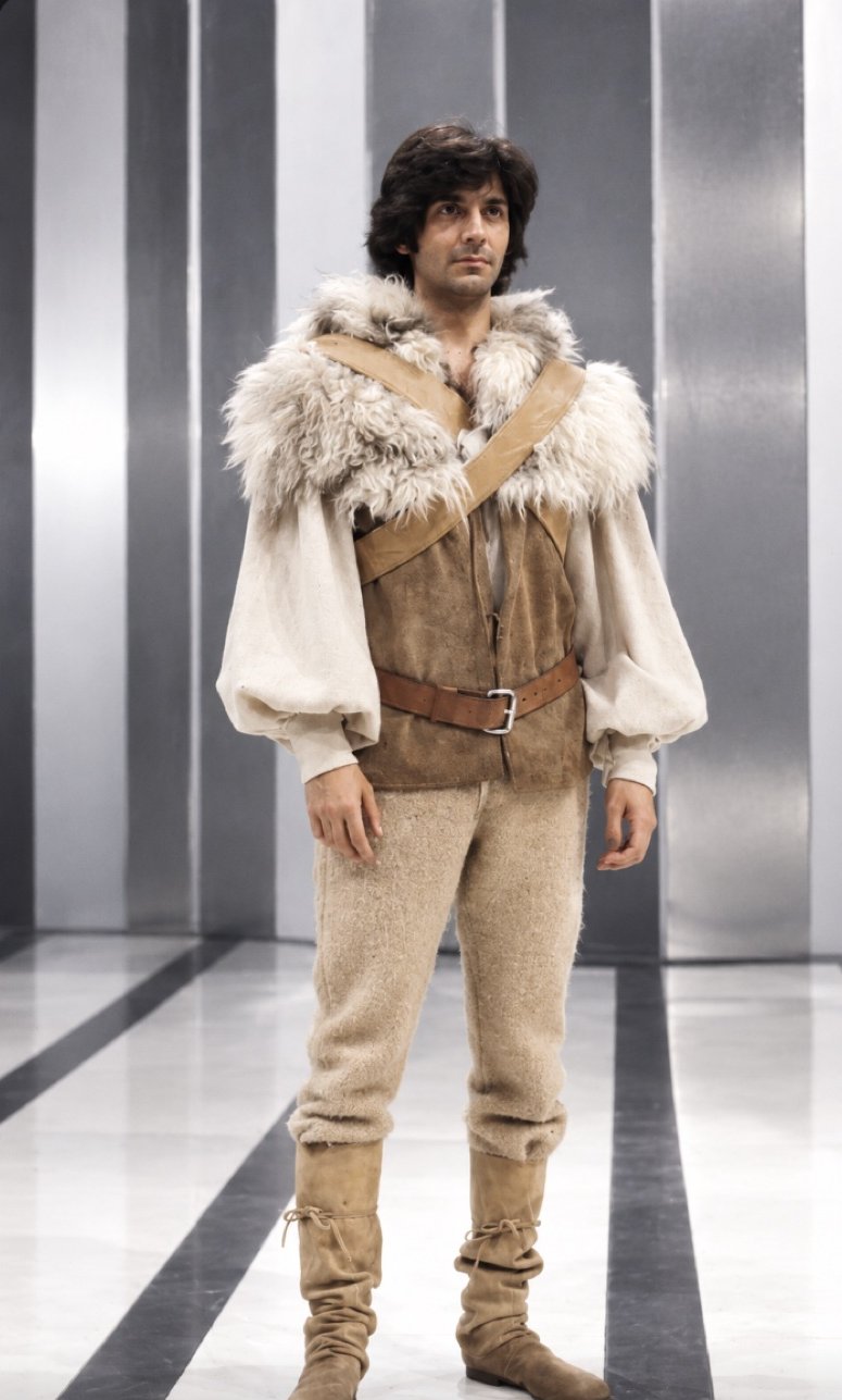 Tom Courtenay in a fur-collared vest and boots, Servants and the Snow, Greenwich Theatre, costumes by Laura Crow