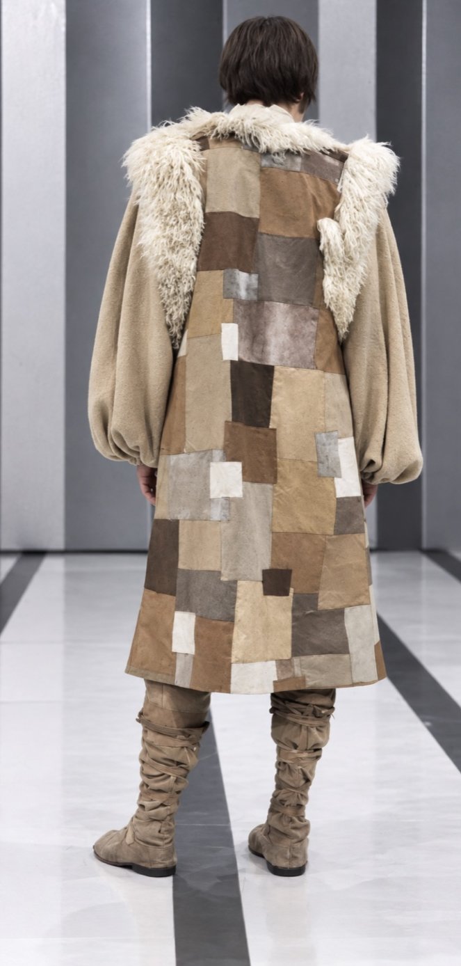 Tom Courtenay in a patchwork fur coat, back view, Servants and the Snow, Greenwich Theatre, costumes by Laura Crow