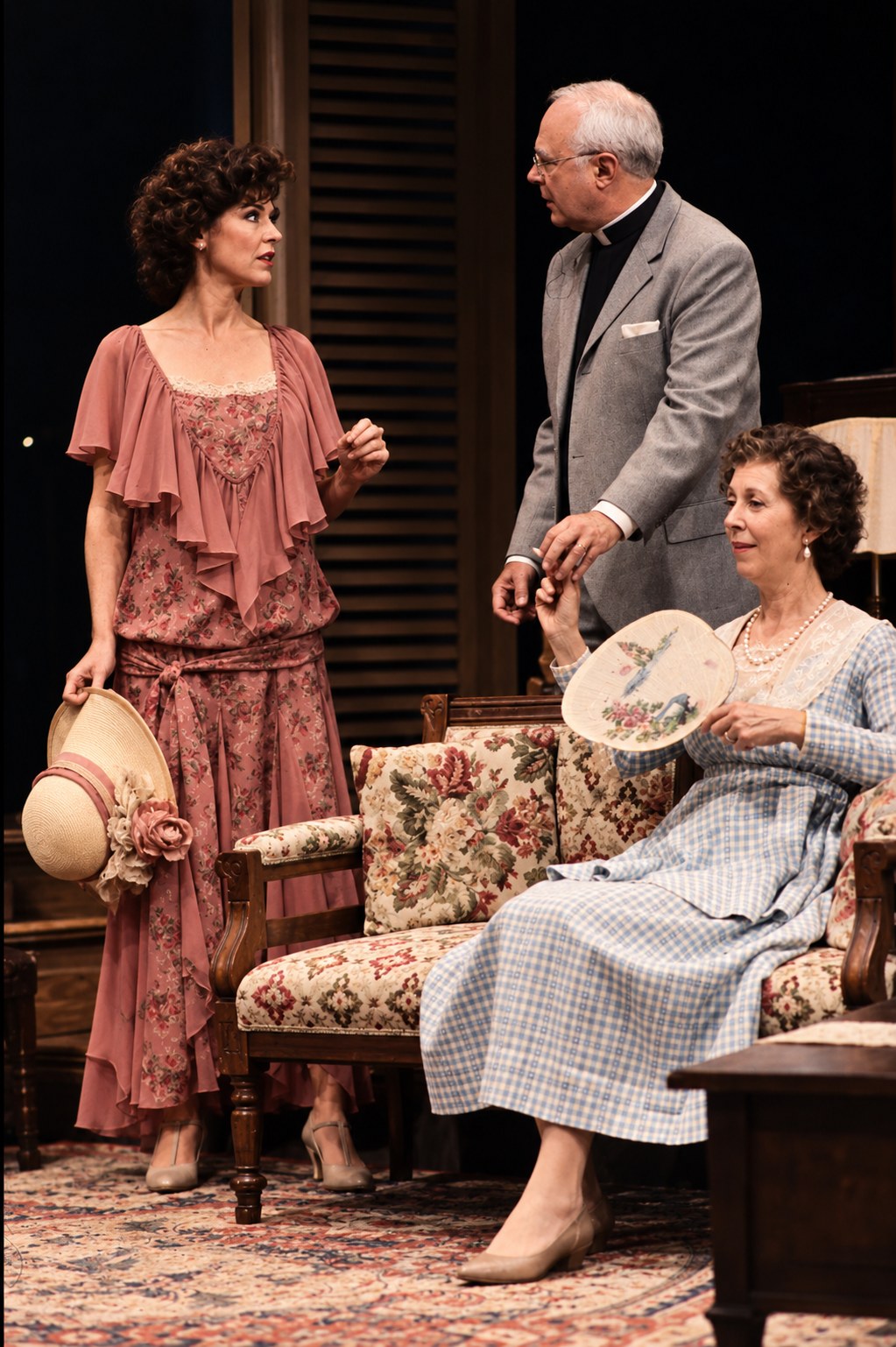 Three performers beside a wicker chair, Summer and Smoke, Ahmanson Theatre, Los Angeles, costumes by Laura Crow