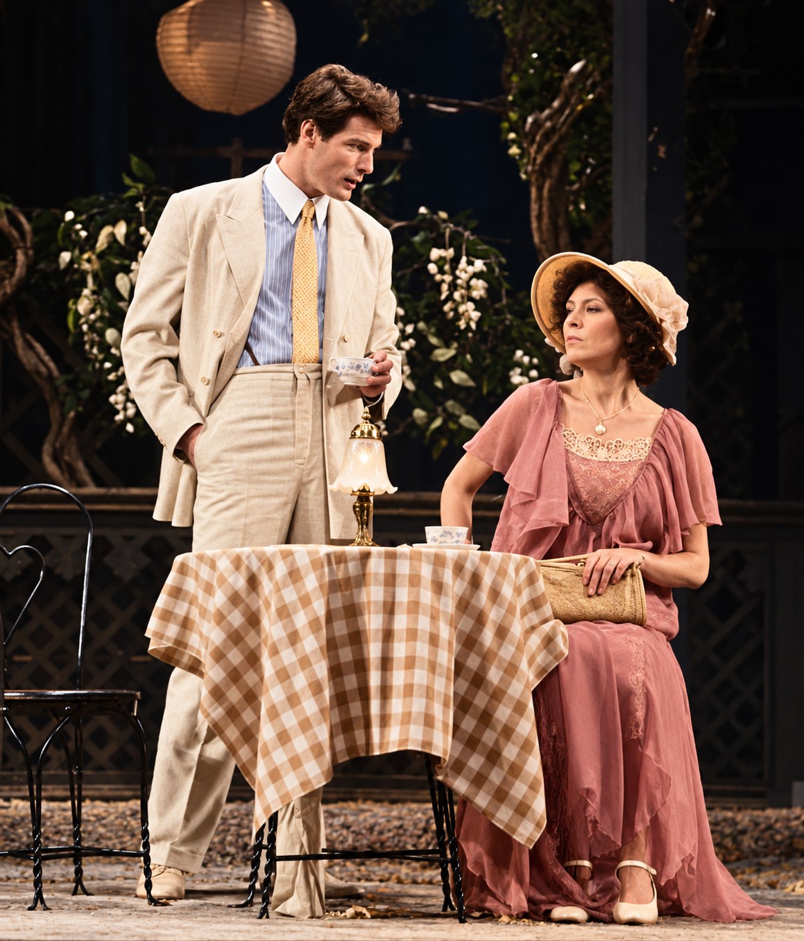 Two performers beside a garden table, Summer and Smoke, Ahmanson Theatre, Los Angeles, costumes by Laura Crow
