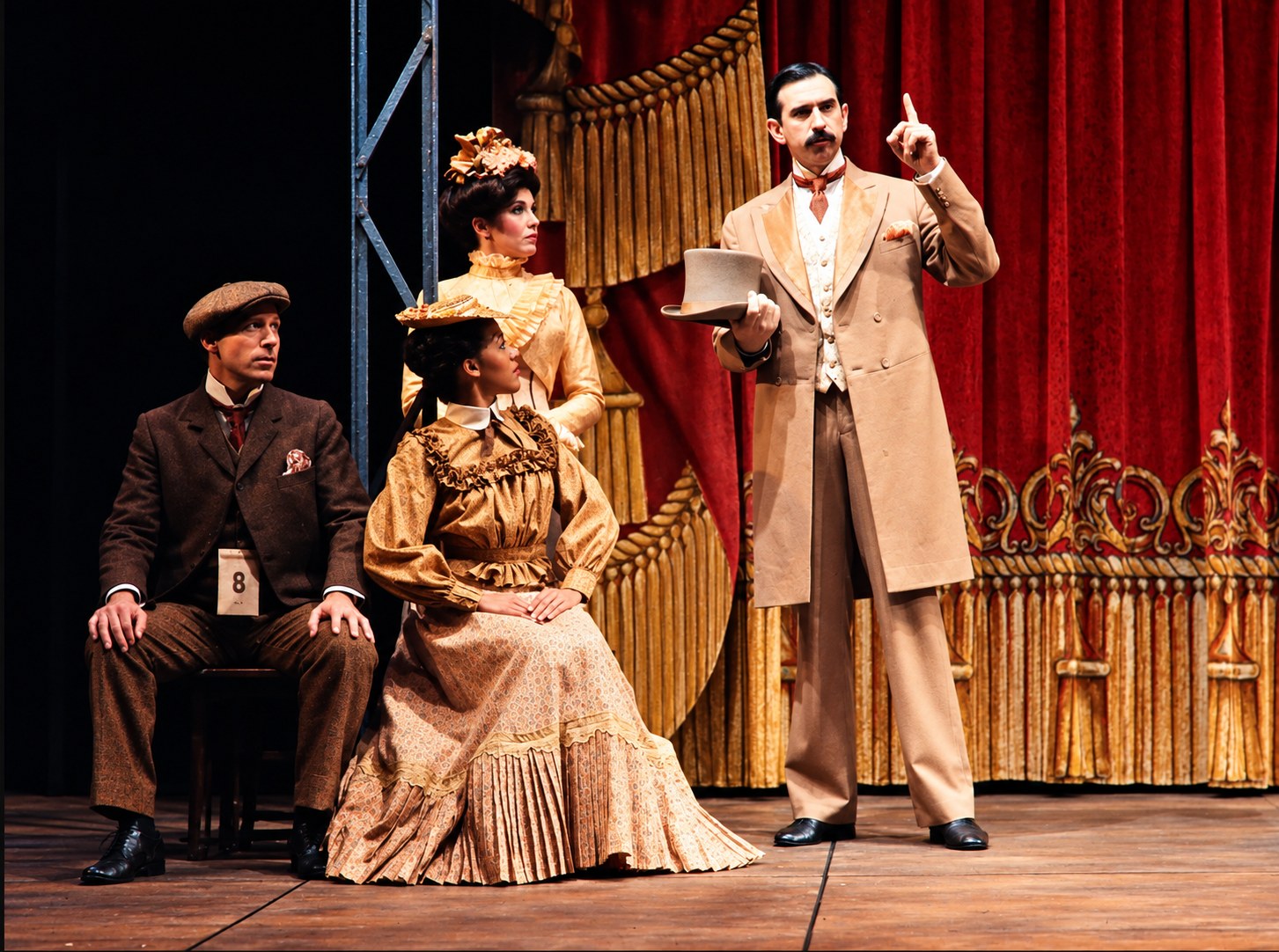 Ensemble in front of a red curtain, Tintypes, Seattle Repertory Theatre, costumes by Laura Crow