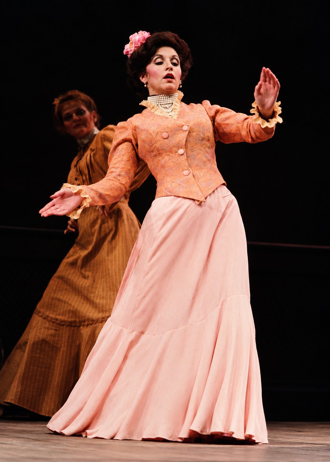 Performer in a peach jacket and pink skirt, Tintypes, Seattle Repertory Theatre, costumes by Laura Crow