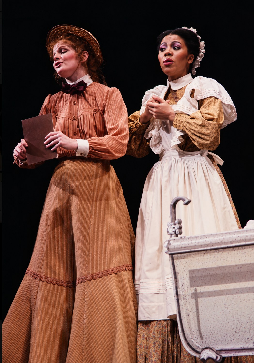 Two women beside a white cabinet, Tintypes, Seattle Repertory Theatre, costumes by Laura Crow