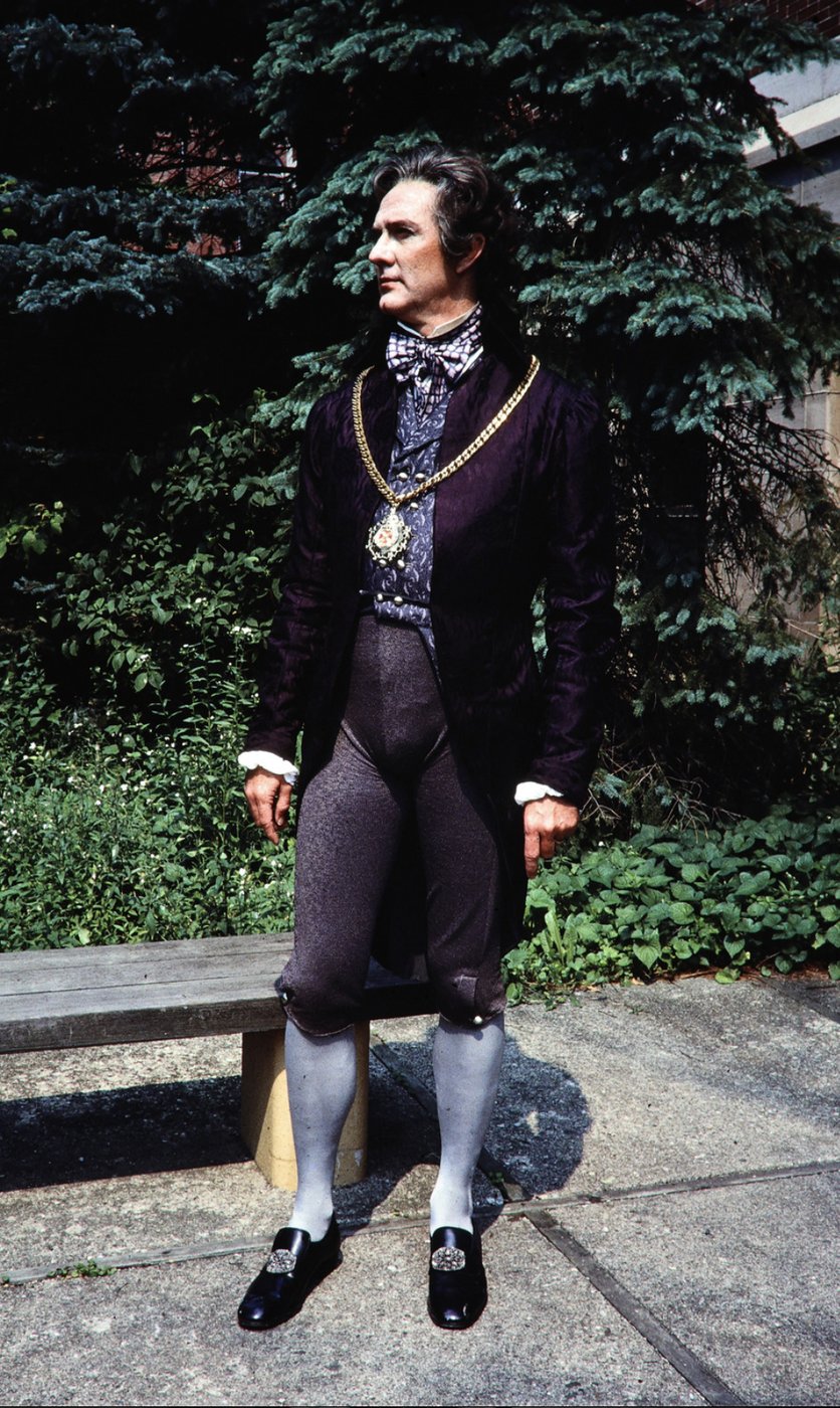 Courtier in dark doublet, production photo, Twelfth Night, Academy Festival Theatre, costumes by Laura Crow